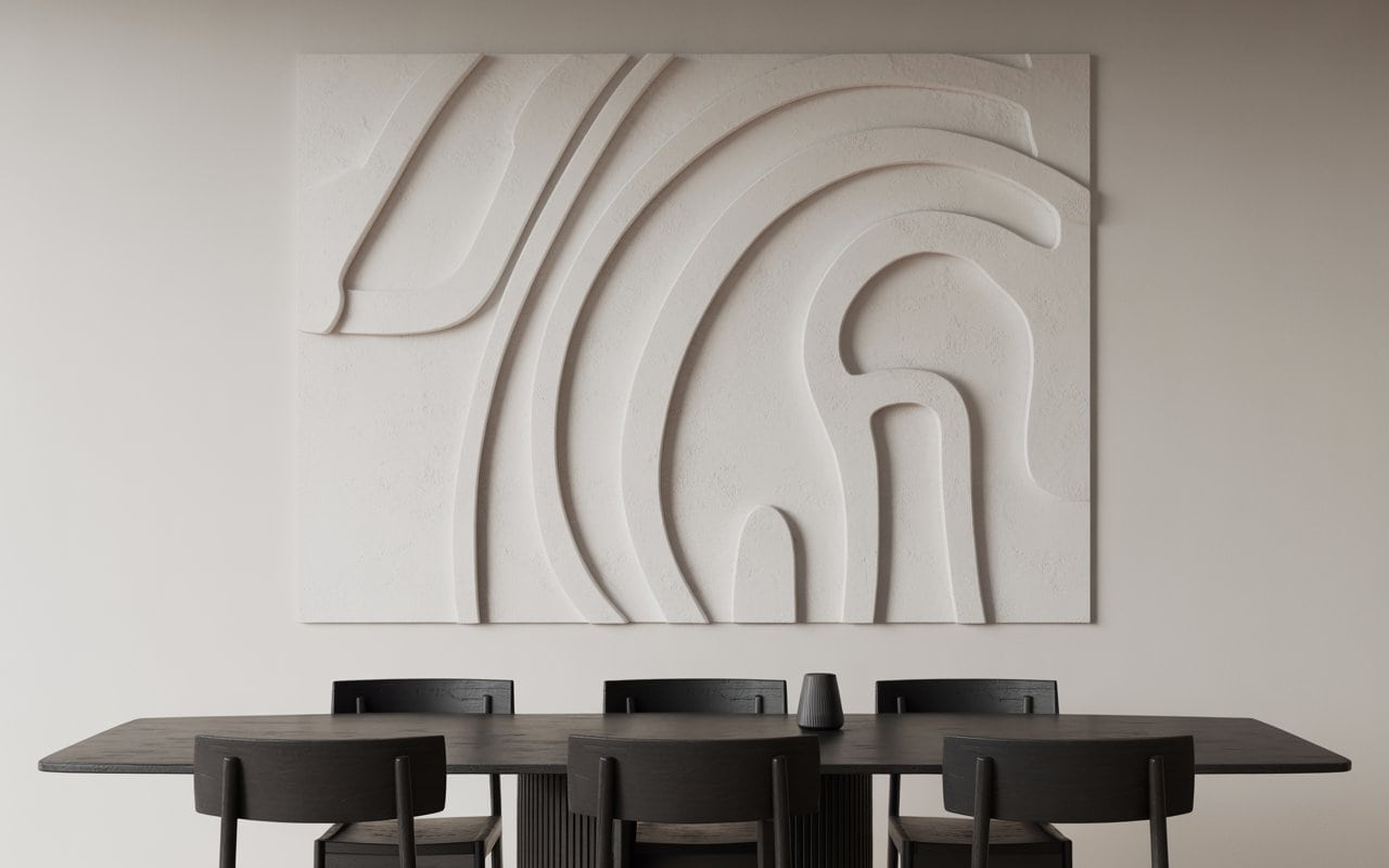 A minimalist dining room with a large 5-foot by 4-foot canvas on the main wall. The art is a minimalist plaster relief with organic curved lines. The dining table below is dark oak with black chairs.