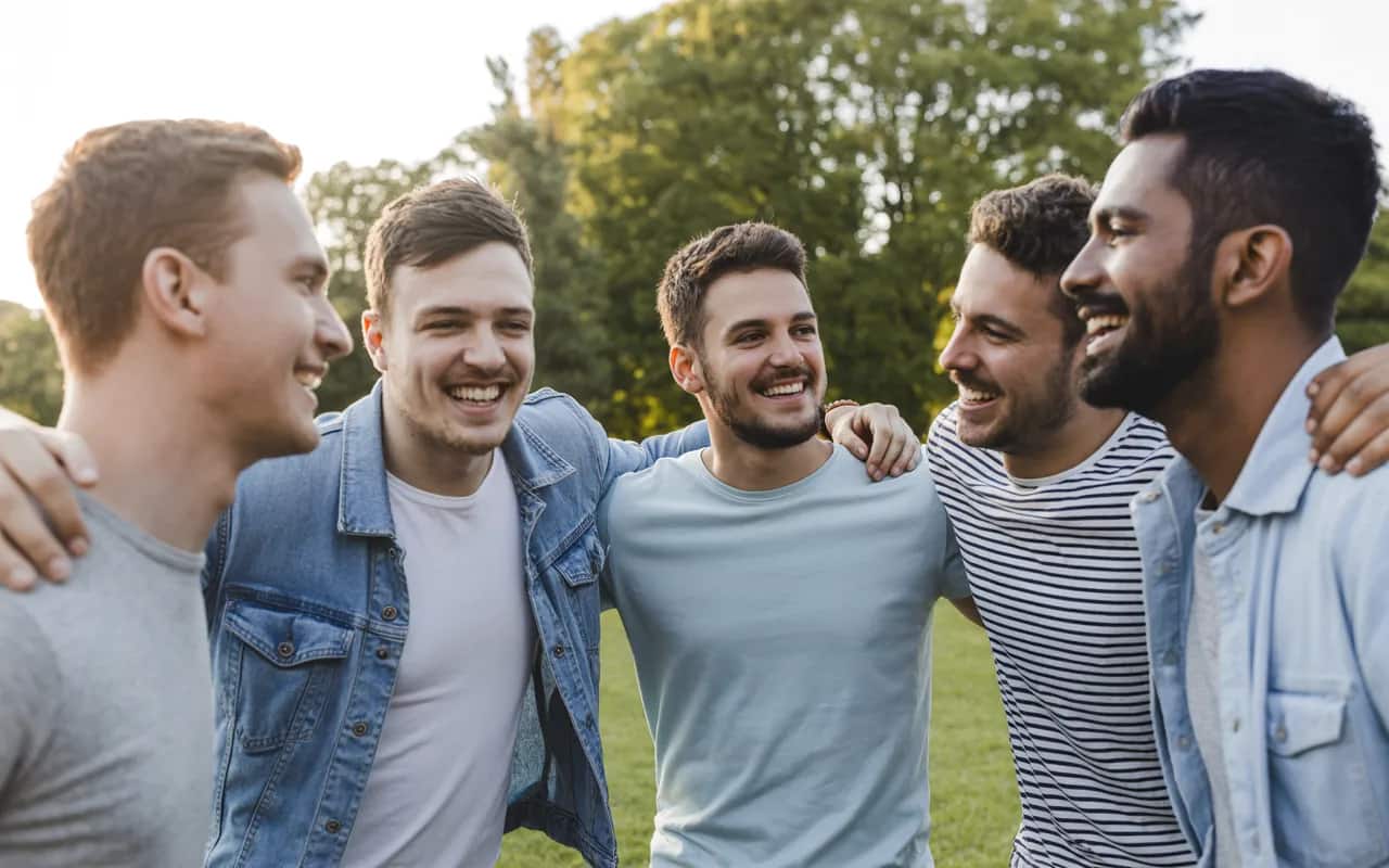 Group of friends enjoying outdoor activities together, laughing and bonding in a sunny park, symbolizing social connections and support networks.”
