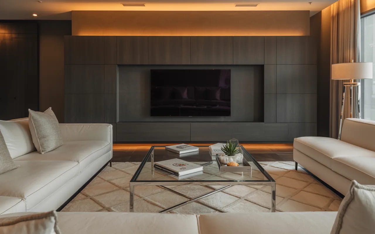 Modern luxury living room with stylish TV wall, plush sofa set, elegant coffee table, designer rug, ambient lighting, cozy interior."