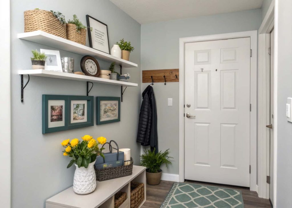 Apartment small home entrance wall decor with floating shelf, decorative objects, compact modern entryway
