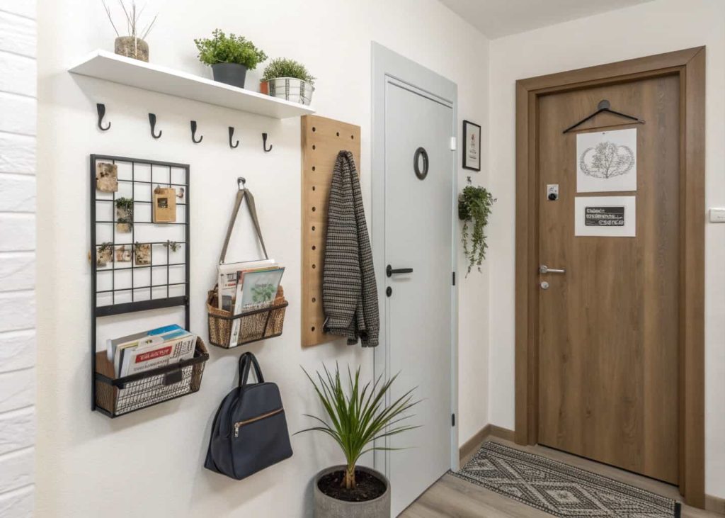 Apartment small home entrance wall decor with mounted magazine holder, keys, mail, compact stylish entryway
