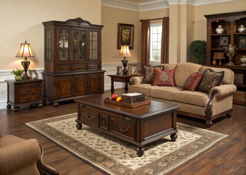 Traditional living room featuring dark wood furniture, classic flooring, and warm decorative accents