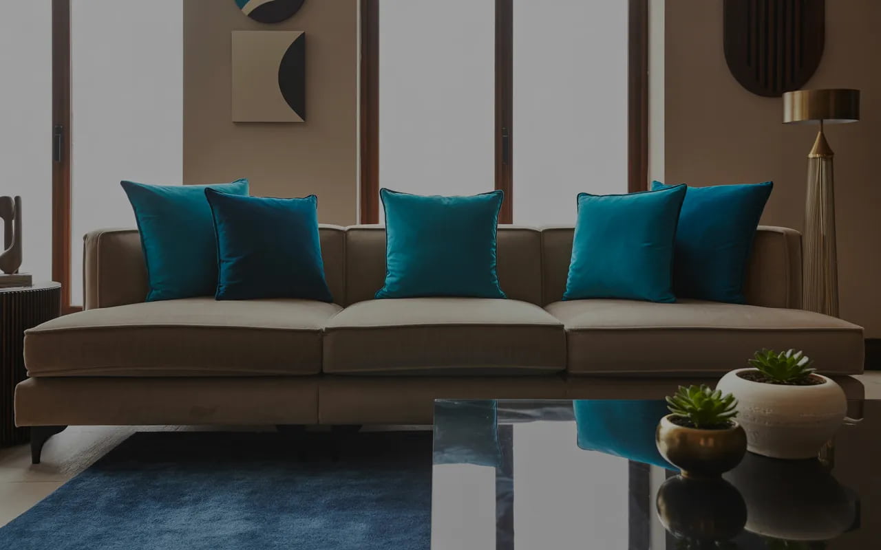 Living room with dark beige sofa, teal cushions, navy rug, neutral walls, modern stylish décor”