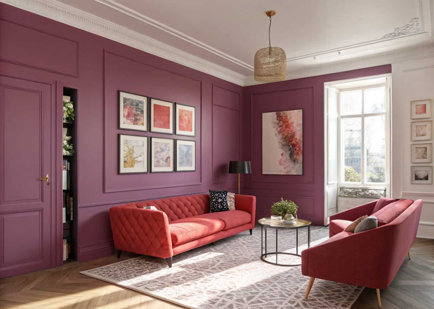 Living room with blush pink walls, deep purple accent wall, red accent furniture, modern artwork, bright sunlight”