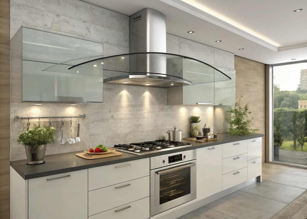 Modern kitchen with curved glass range hood above a sleek cooking area