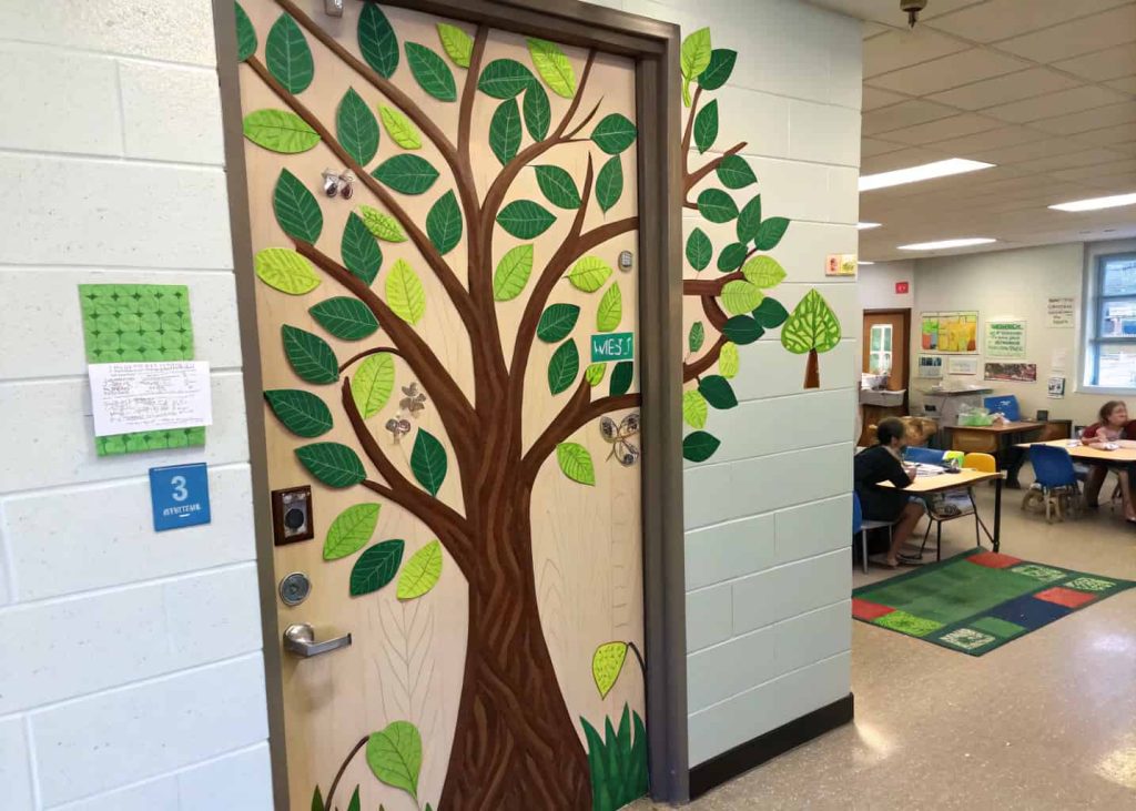 classroom door with large tree and green leaves, growth theme, educational decor