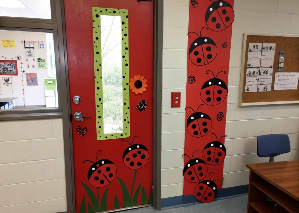classroom door with ladybugs, red and black theme, cute and fun design