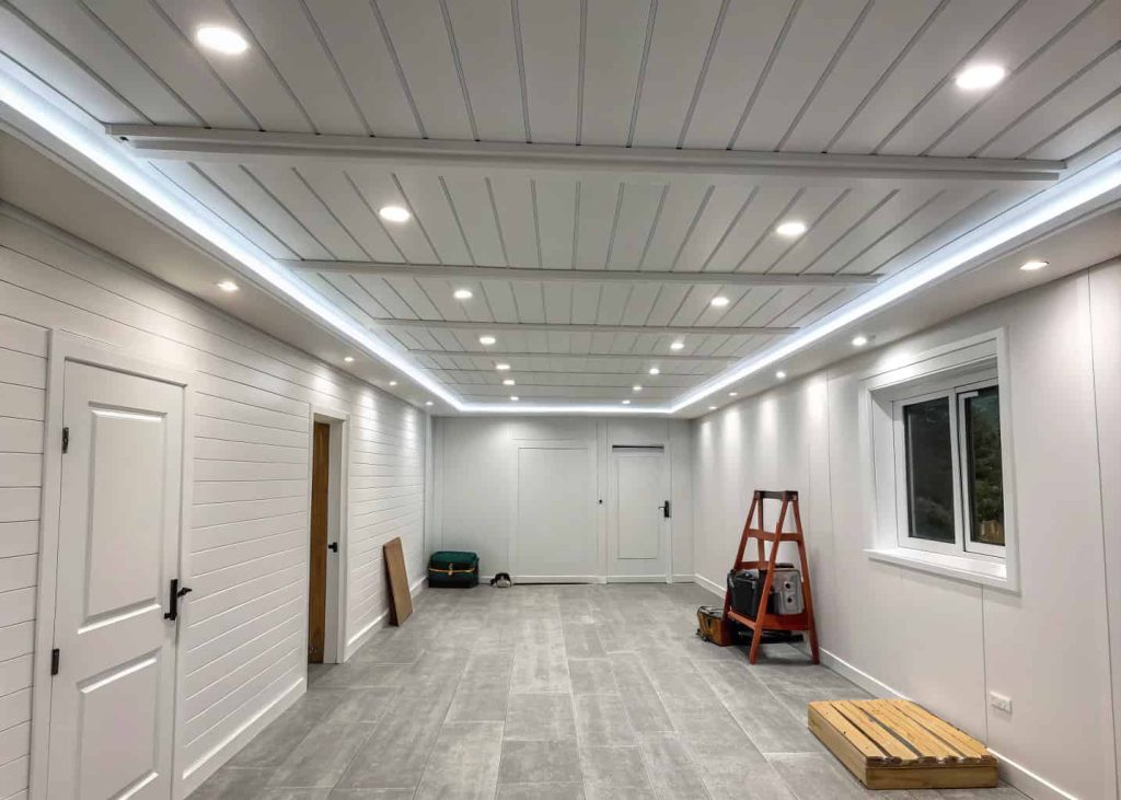 White painted wood panel ceiling in a modern small room, bright lighting, minimal decor, clean aesthetic
