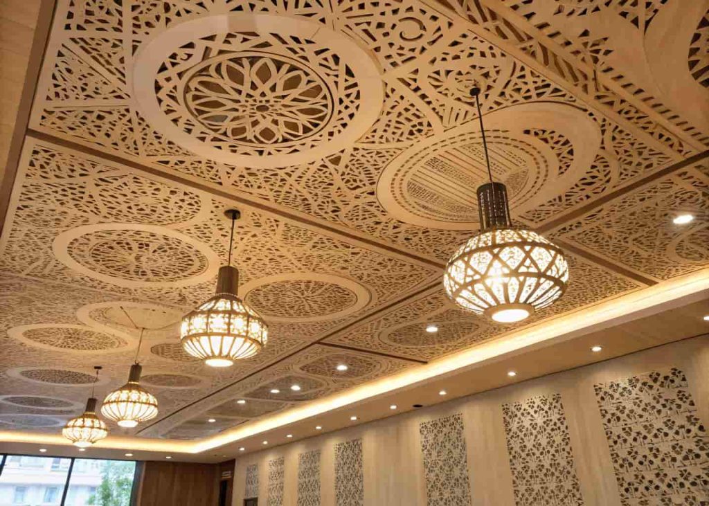 plywood ceiling with cut-out patterns, decorative lighting