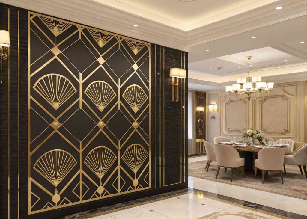 A bold Art Deco geometric feature wall with black and gold fan and hexagon patterns in a luxury dining room.