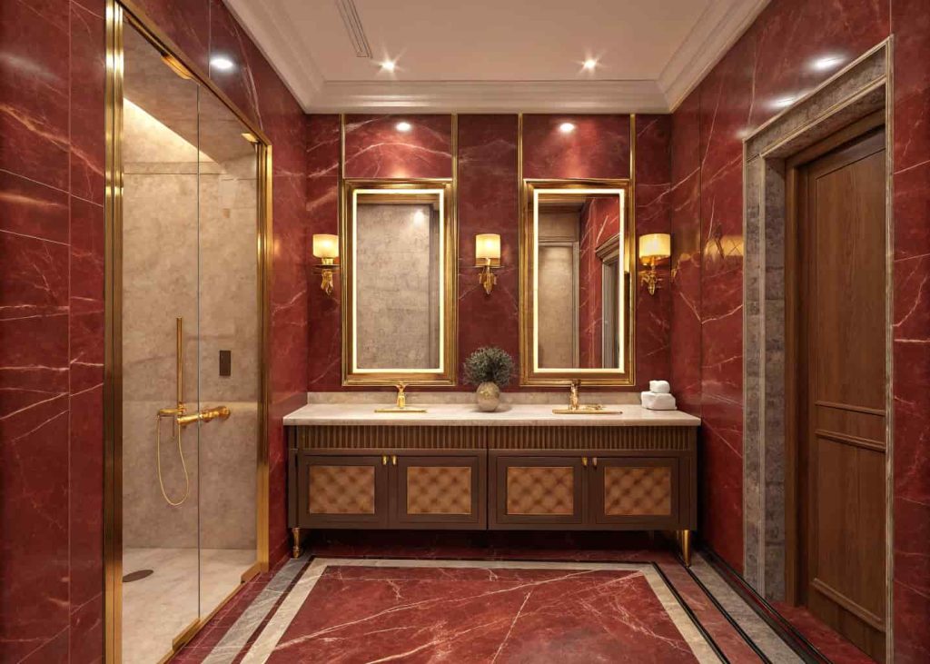 Red marble bathroom with gold accent fixtures and warm elegant lighting creating a regal luxury atmosphere.