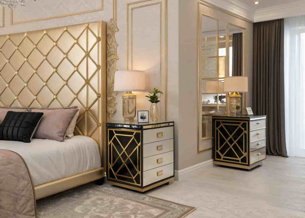 Art Deco bedroom with mirrored bedside tables, crystal lamps, and a gold geometric headboard in champagne tones.