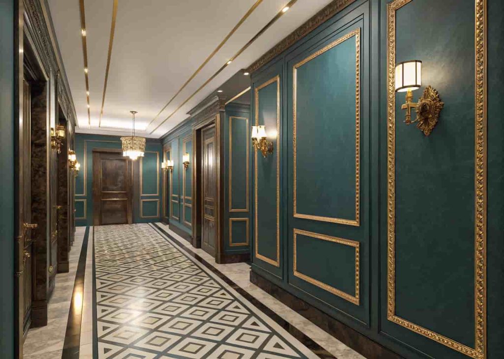 Art Deco hallway featuring tall dark teal lacquered wall panels with gold trim, geometric floor tiles, and brass sconces.