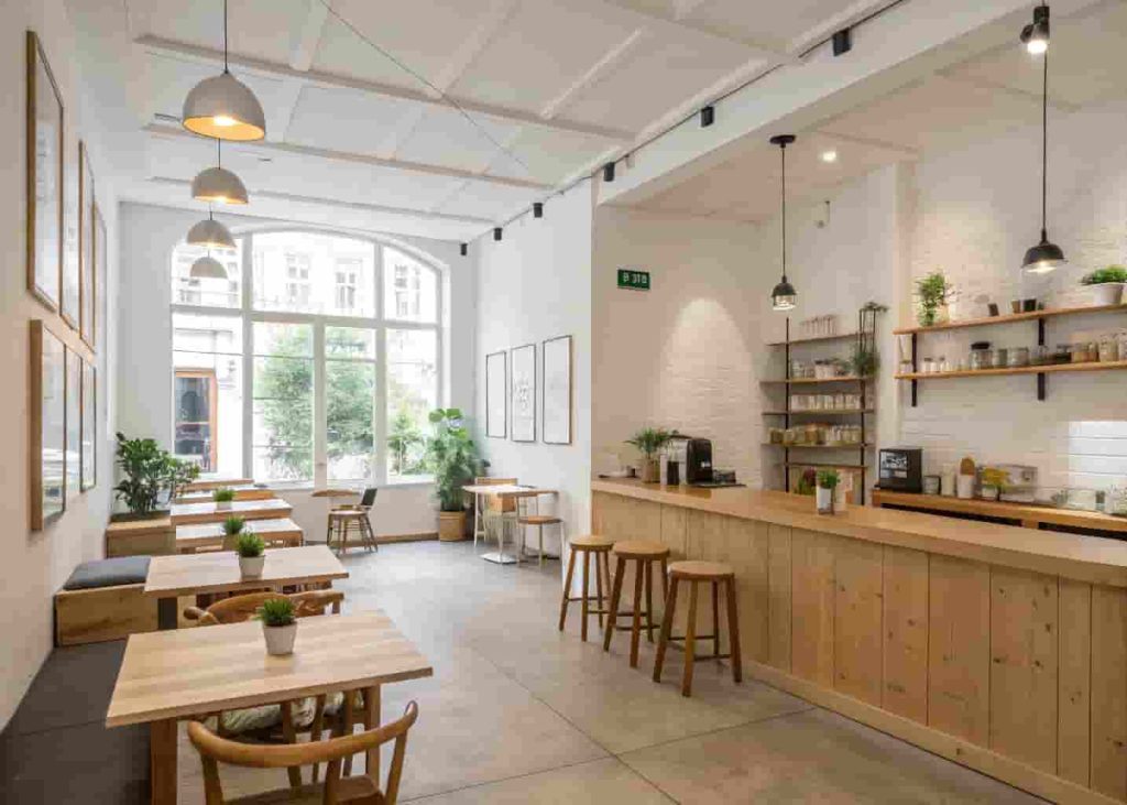 Minimalist cafe interior with open space and simple decor creating a calm and uncluttered relaxing environment