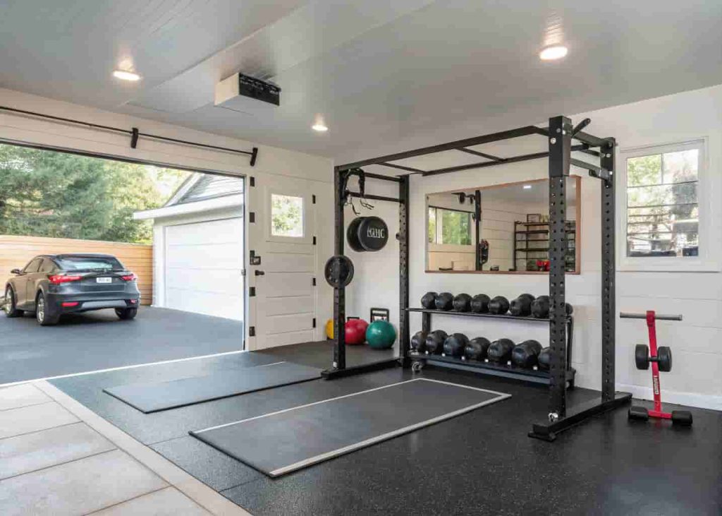 Converted garage gym with professional equipment used for personal training sessions