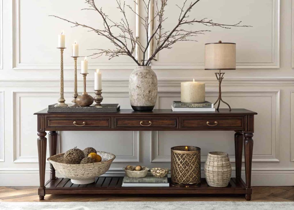 Console table decor arranged with varied heights for visual interest