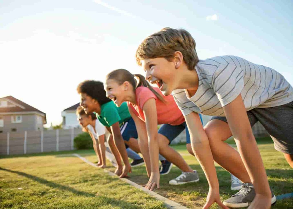 Group of kids ready to start a backyard race during a neighborhood Olympics summer activity