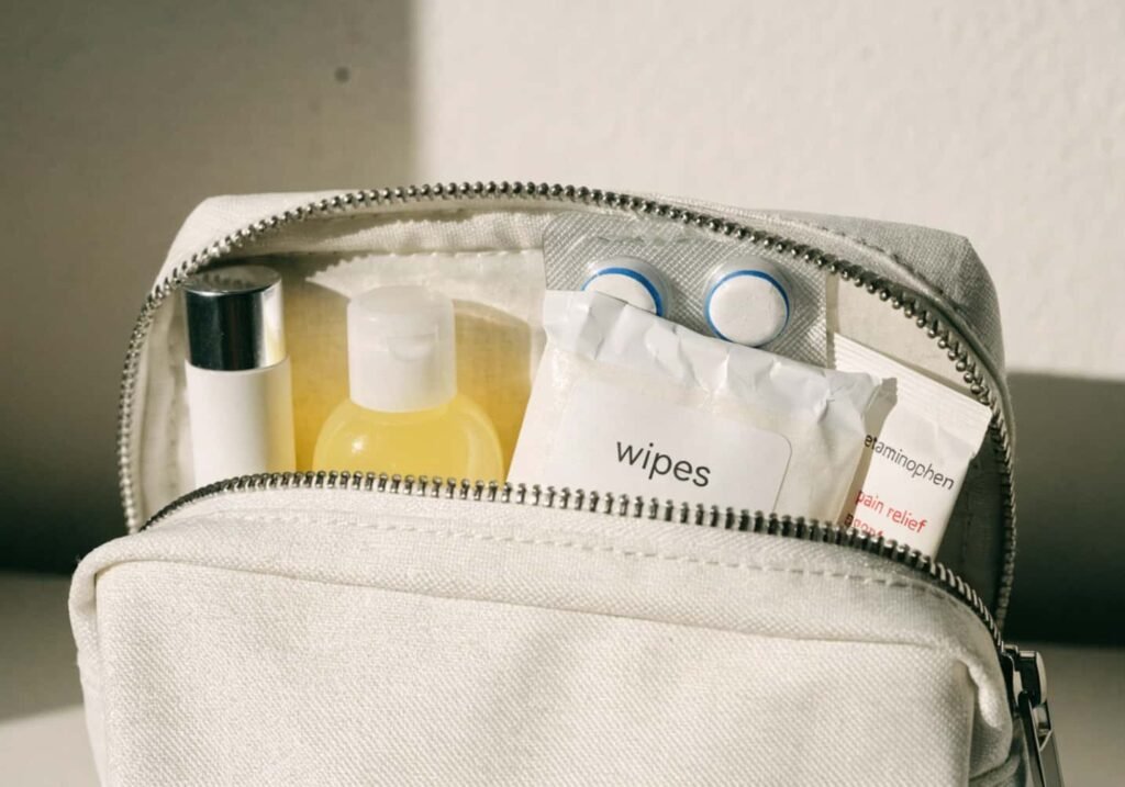 Health and hygiene items including lip balm and wipes packed for flights