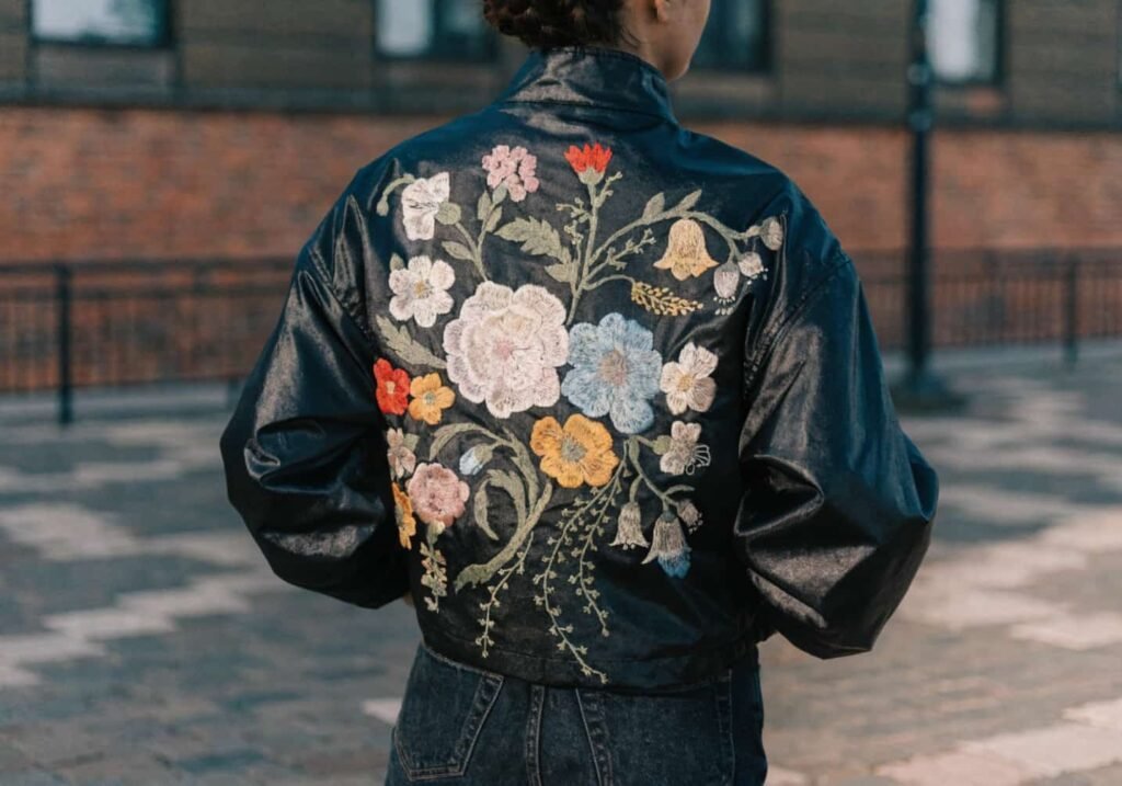Jacket back featuring an oversized floral embroidery statement design