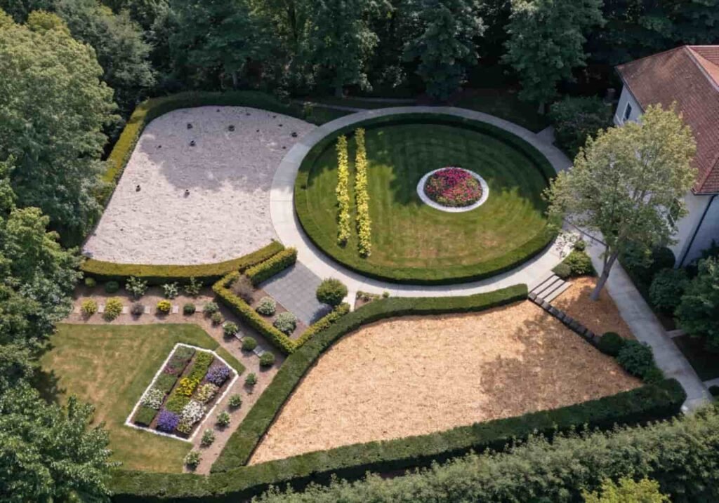 Large garden divided into different zones using hedges and pathways