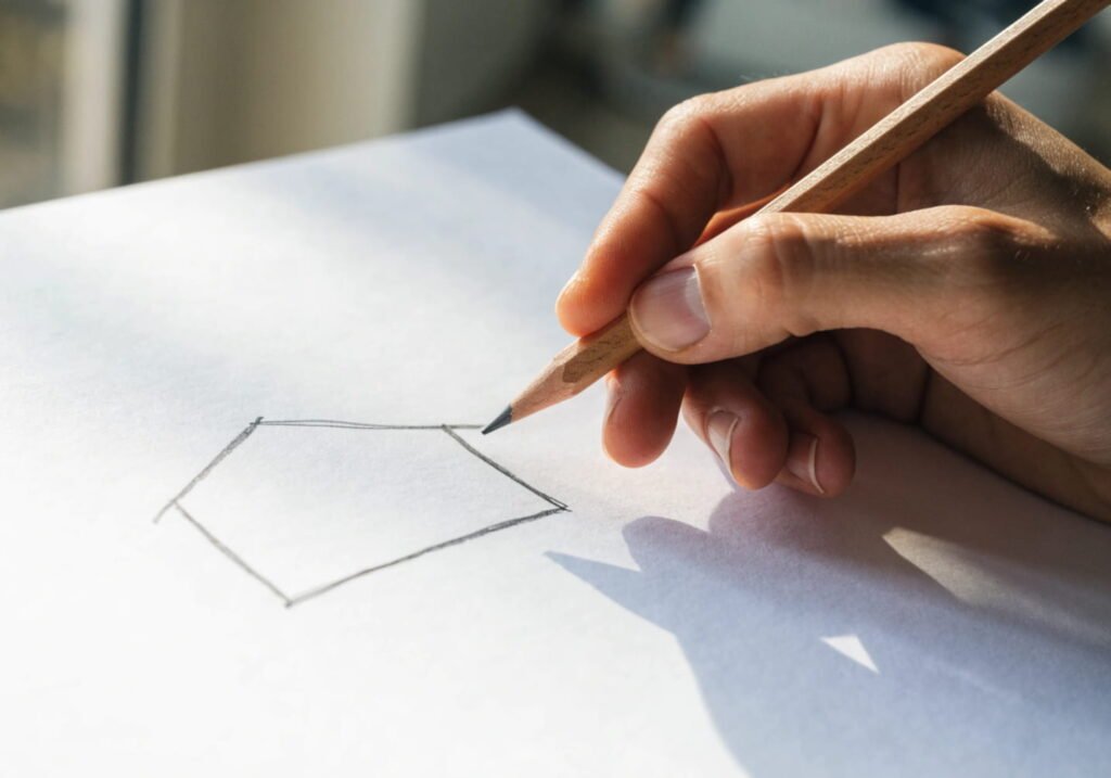 Beginner pencil sketch of a basic rectangle shape starting a house drawing