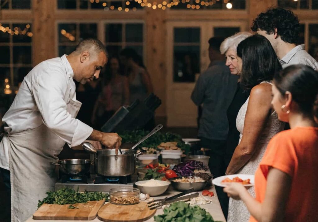 Chef preparing food live at an interactive wedding reception food station