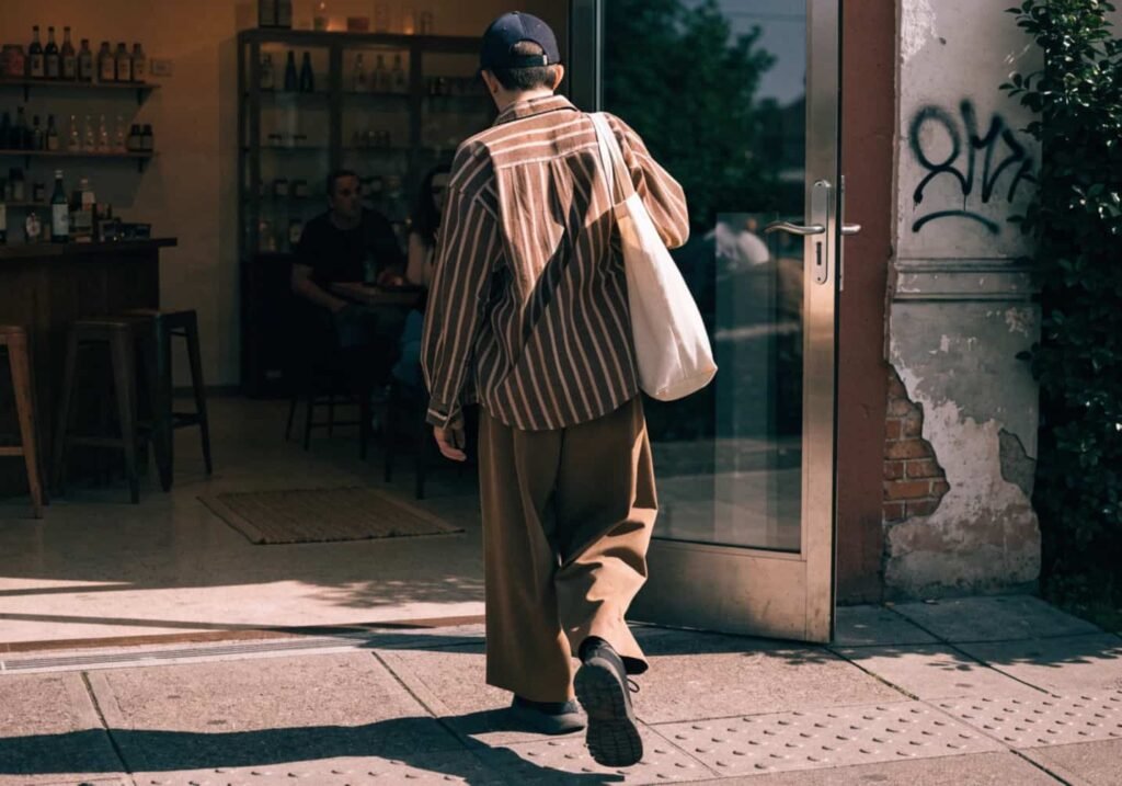Candid walking into aesthetic cafe entrance photo with natural light
