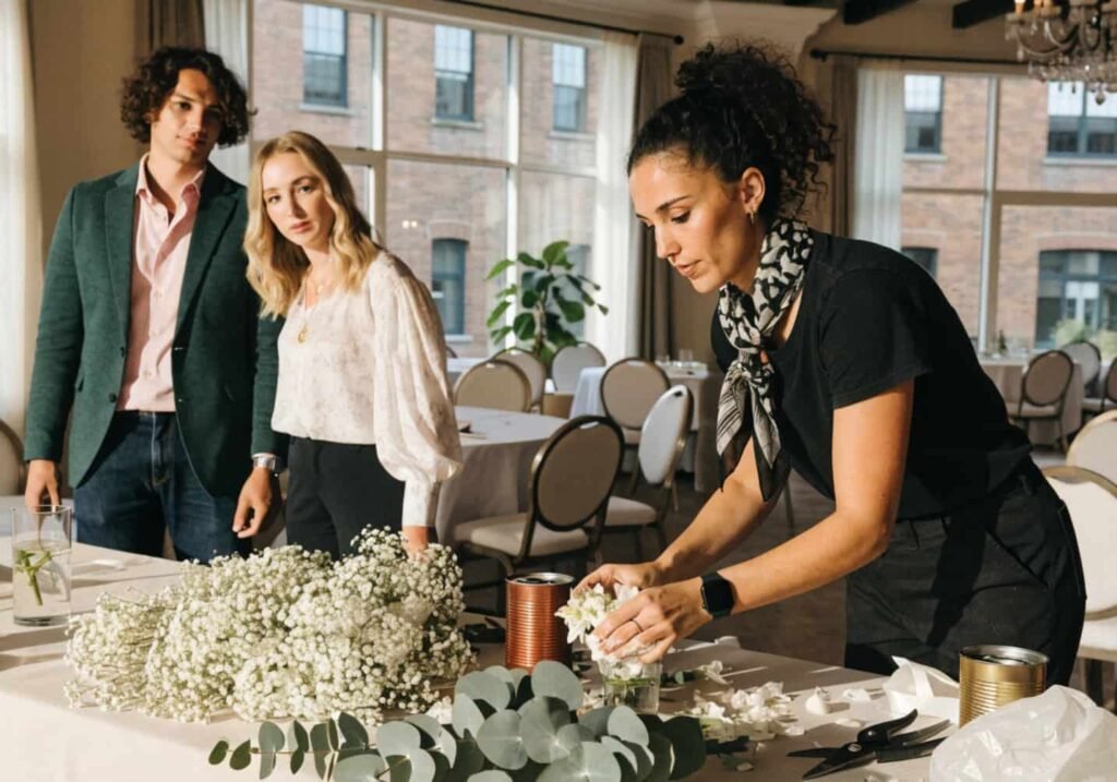 Wedding decorator sharing professional input on the chosen theme