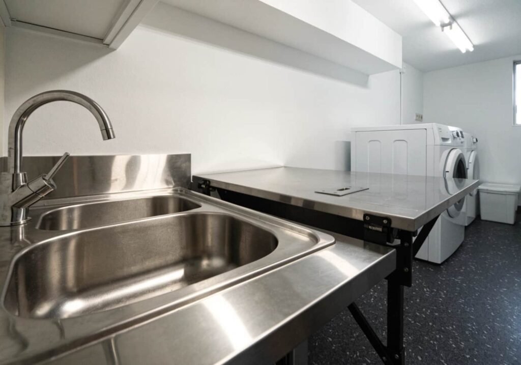 Stainless steel sink paired with a matching folding table surface