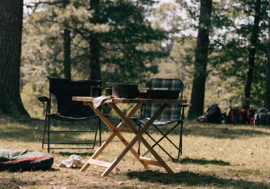 Lightweight folding camping table set up outdoors at a campsite