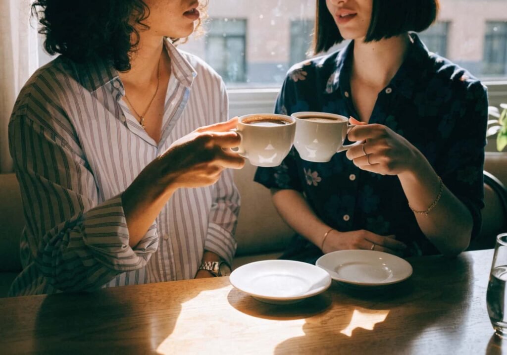 Couple sharing a coffee moment together at a cafe table