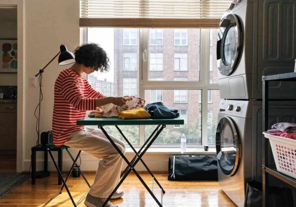 Slim folding table next to stackable washer and dryer