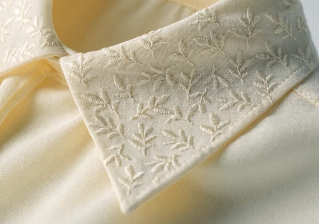 Cream shirt collar with subtle tone-on-tone micro embroidery detail