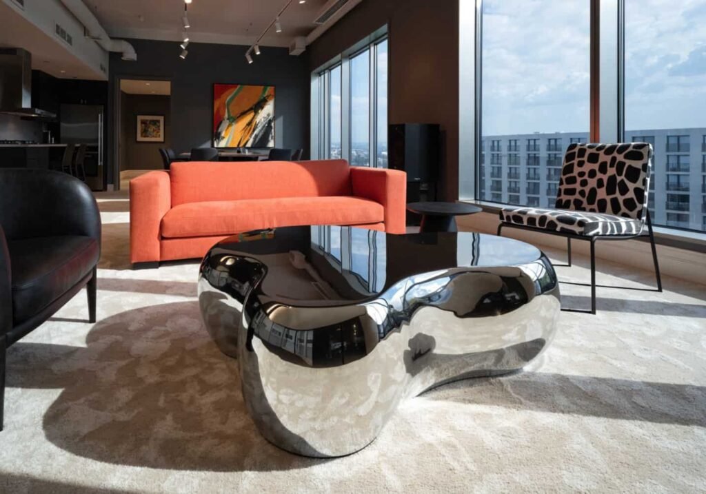 Chrome home decor trend 2026 liquid metal coffee table centerpiece