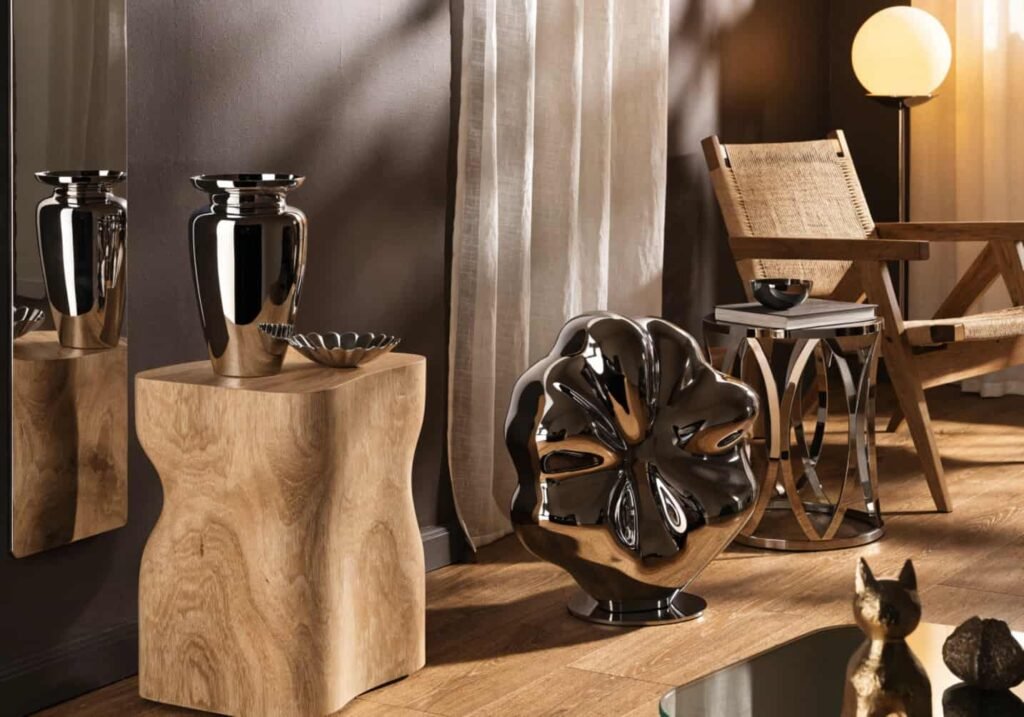 2026 home decor trend mixing liquid chrome accents with wood furniture