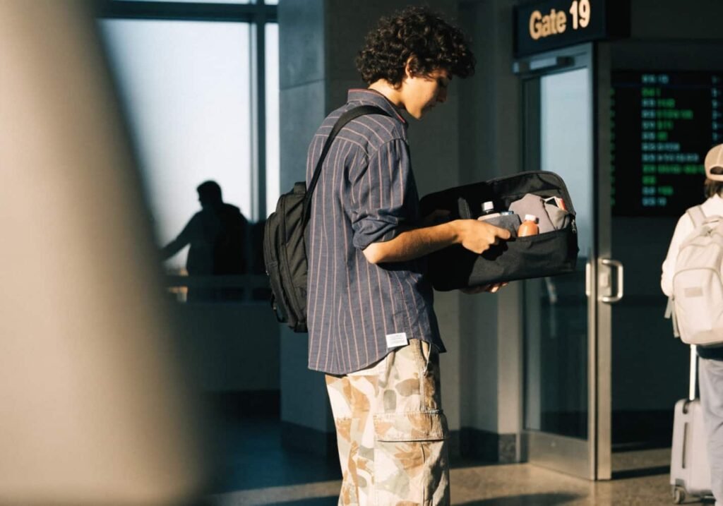 Traveler doing a final checklist review at the boarding gate before flight