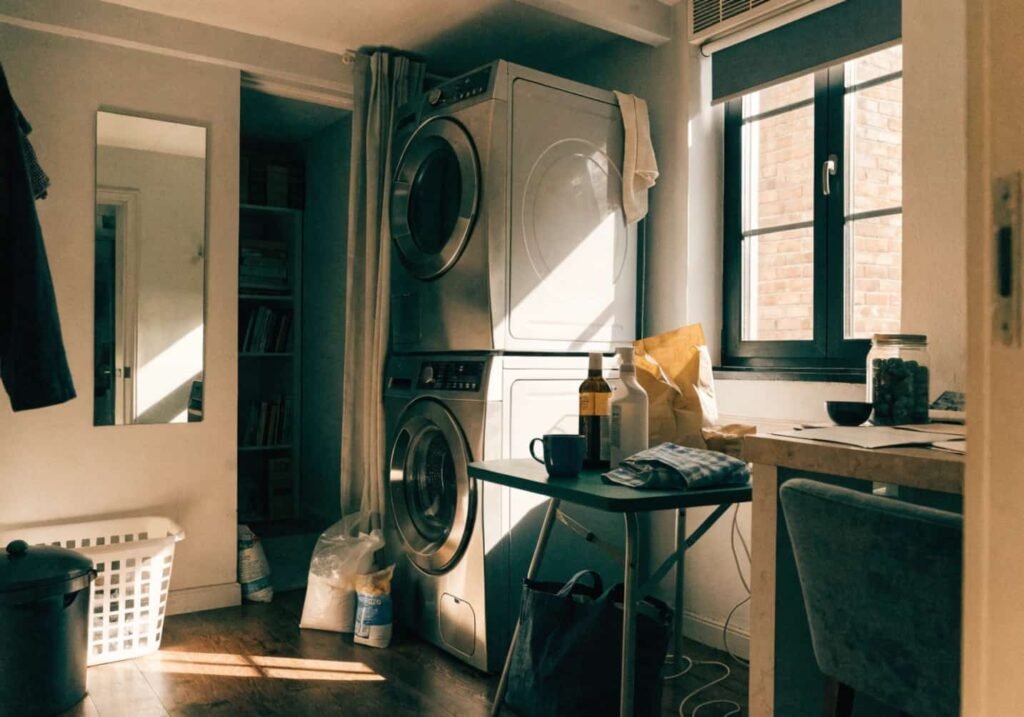 Small apartment laundry room with compact folding table