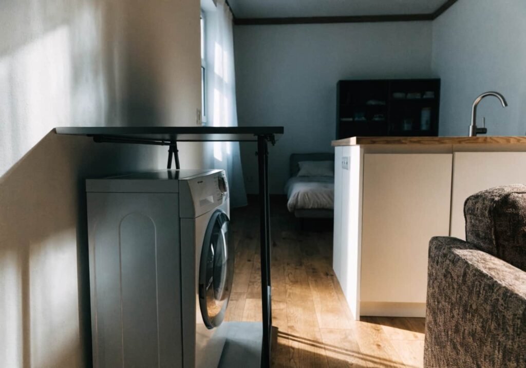 Wall-mounted folding table for studio apartment laundry