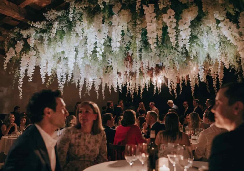 Statement ceiling floral installation at wedding reception
