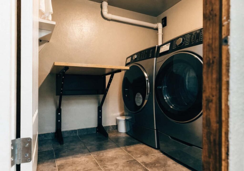 Space-saving folding table for closet laundry setup
