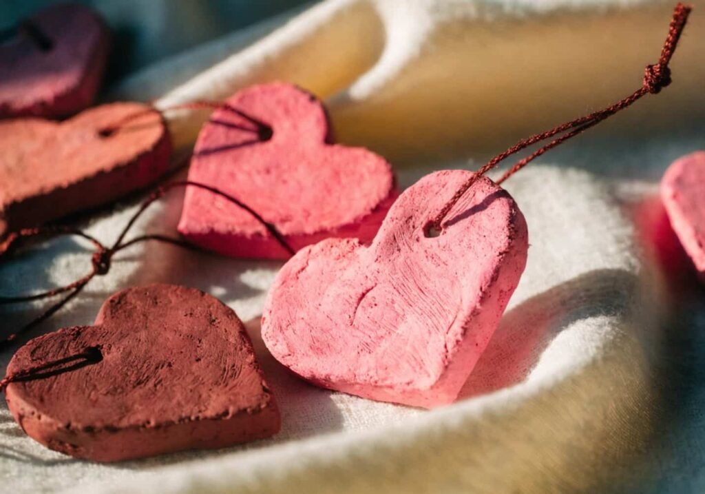 Handmade clay heart charms with string, ready to gift