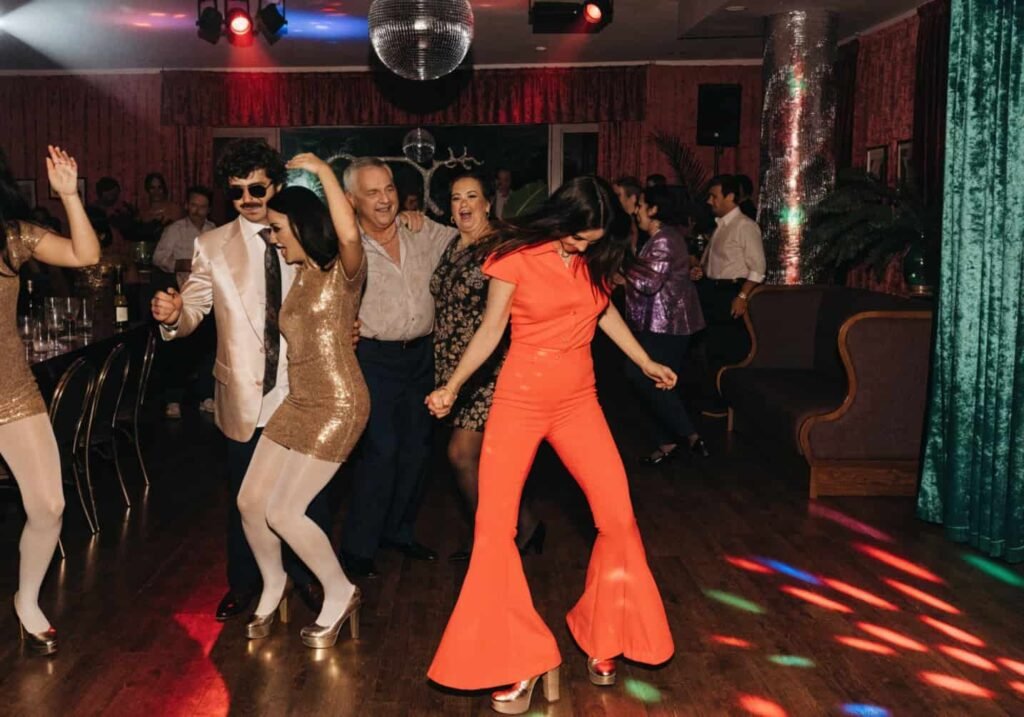 70s disco glam wedding reception dance floor decor