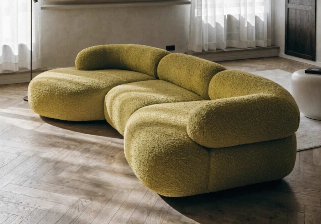 Bold colored sectional sofa used as a living room statement piece