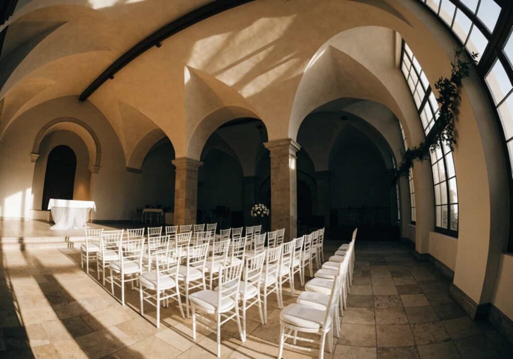 Indoor wedding ceremony venue with vaulted ceilings and natural light