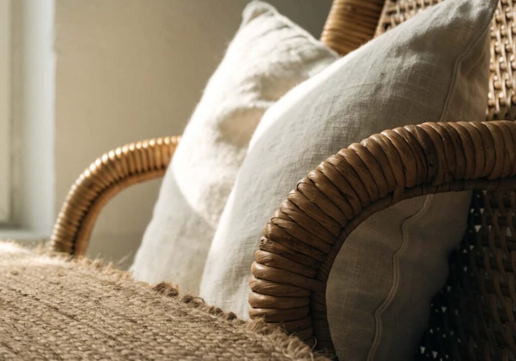 Natural jute and rattan textures layered in a gray boho living room