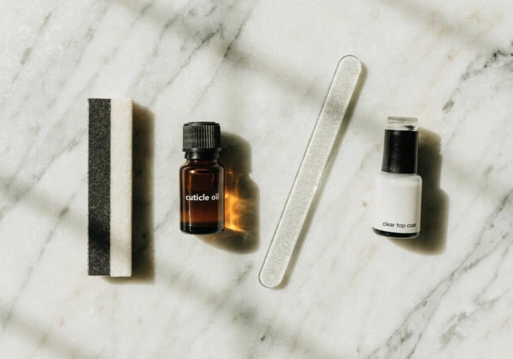 Flat lay of essential nail care tools for a quiet luxury manicure