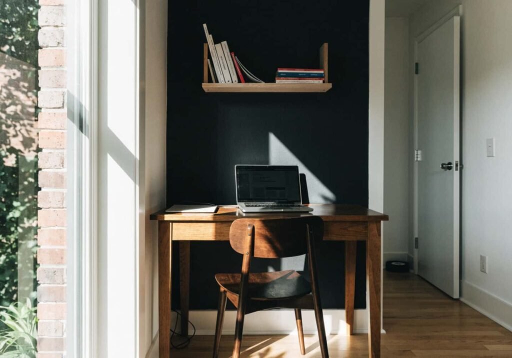Home office with a single black wall adding depth without overwhelming the space