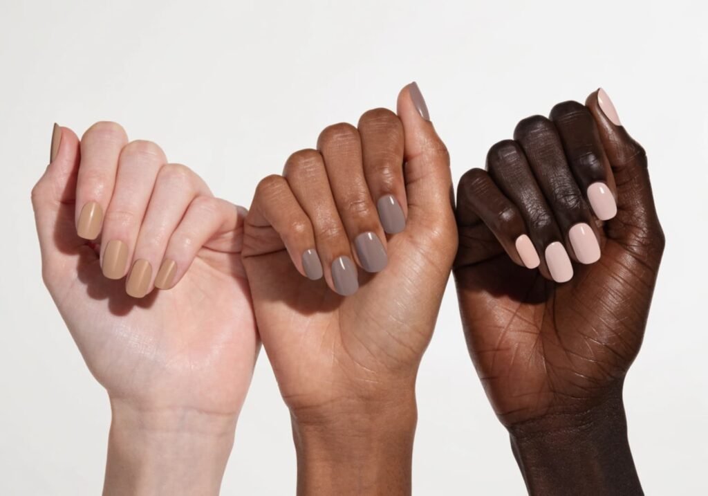 Comparison of neutral nail polish shades across different skin tones