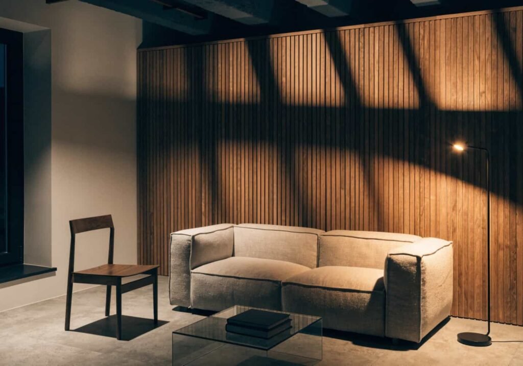 Wood slat textured accent wall with warm shadows in a living room