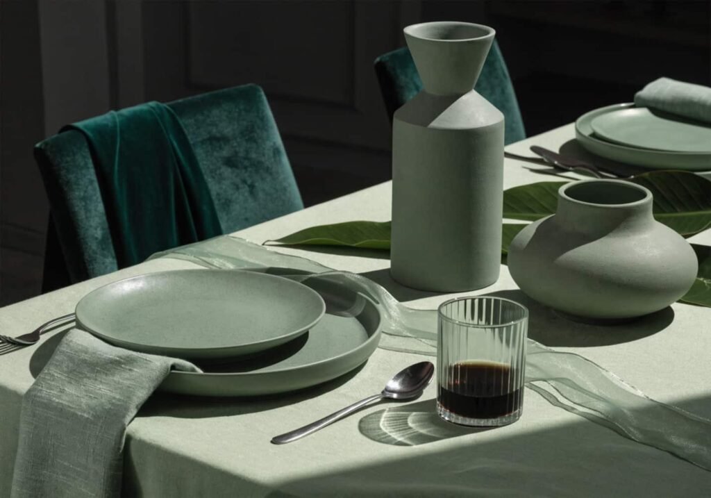 A monochrome green wedding tablescape using varied textures for contrast.